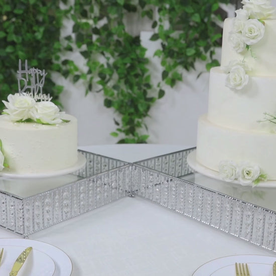 Silver cake stand with hanging crystal beads and glass top, perfect for desserts.