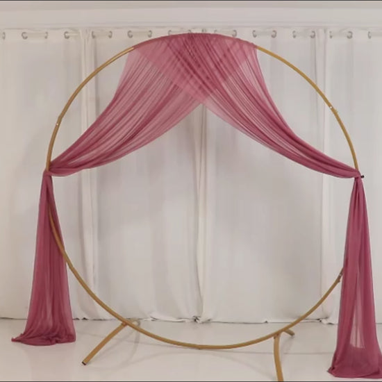 Mauve sheer backdrop drape for wedding arch and ceiling decor.