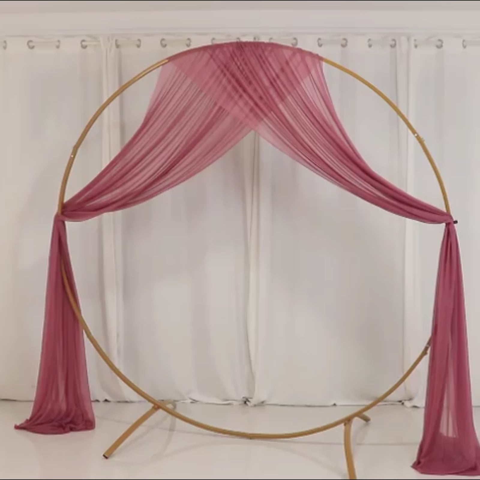 Mauve sheer backdrop drape for wedding arch and ceiling decor.