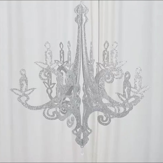Silver glittered acrylic chandelier hanging decor with a 3D interlocking design.