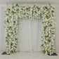 White roll-up flower backdrop with artificial silk roses and hydrangeas.
