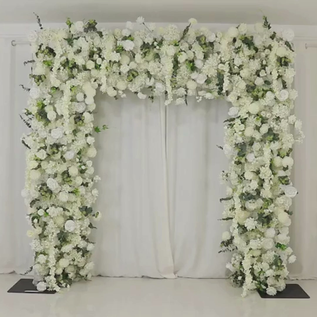 White roll-up flower backdrop with artificial silk roses and hydrangeas.
