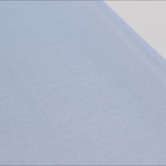 Dusty blue shimmer sheer table runner fabric close-up.