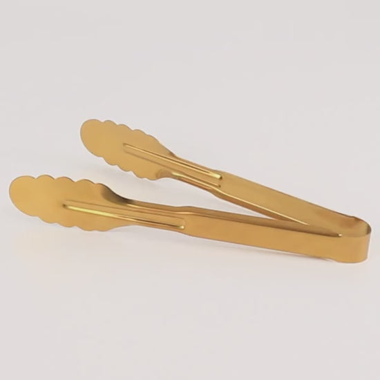Gold metal kitchen tongs with scalloped edge and easy grip.