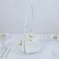 Whitewashed metal floral hoop cake stand with beaded wooden base.
