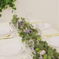 6ft artificial eucalyptus garland with lavender silk roses on a table setting.