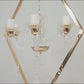 Gold 6-arm acrylic candelabra centerpiece with candle holders.