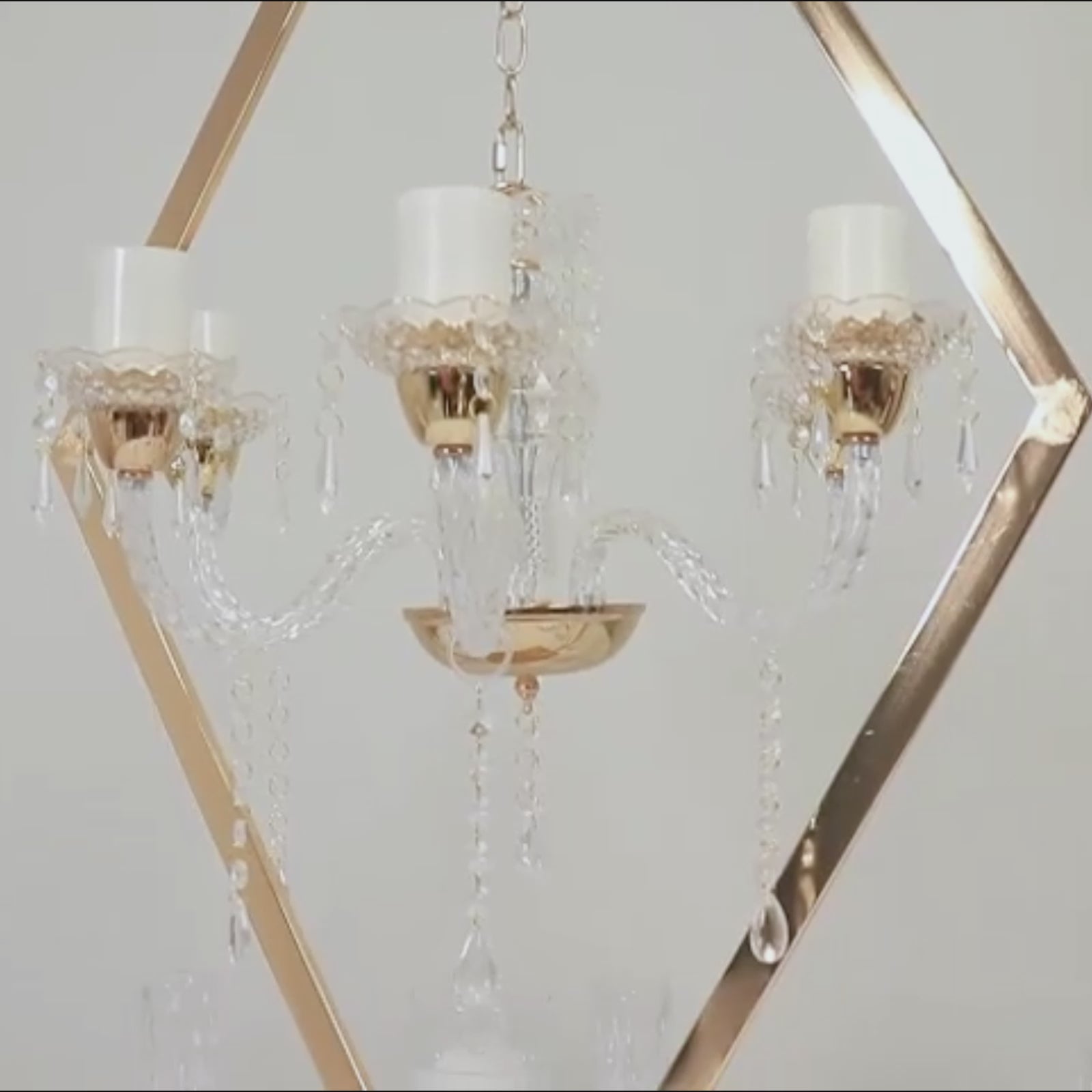 Gold 6-arm acrylic candelabra centerpiece with candle holders.