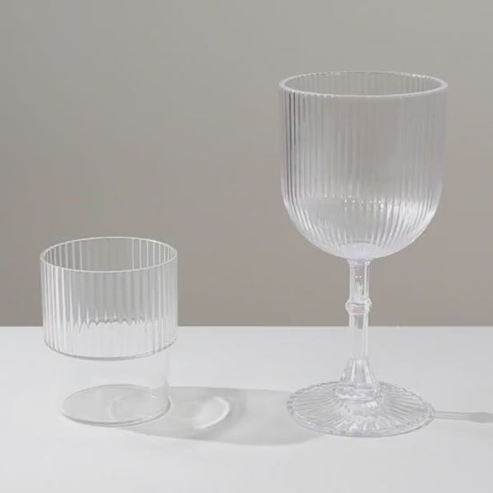 Clear ribbed reusable plastic wine goblets, shatterproof vintage design.