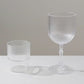 Clear ribbed reusable plastic wine goblets, shatterproof vintage design.
