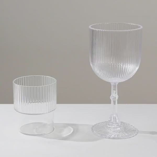 Clear ribbed reusable plastic wine goblets, shatterproof vintage design.