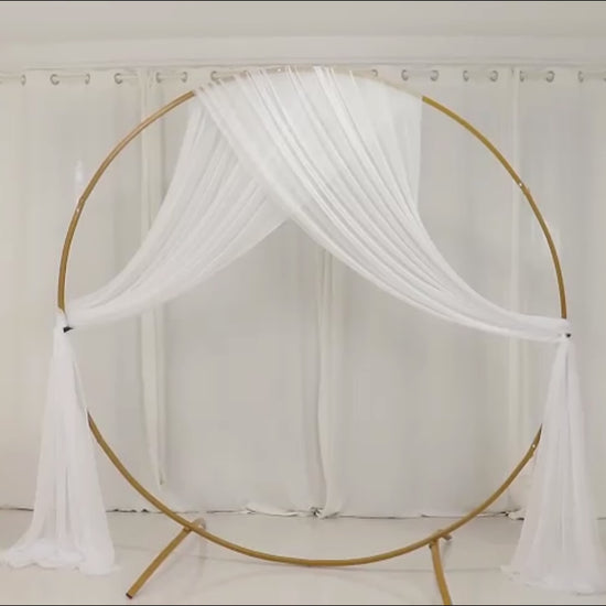 White sheer backdrop drape for wedding arch and ceiling decor.