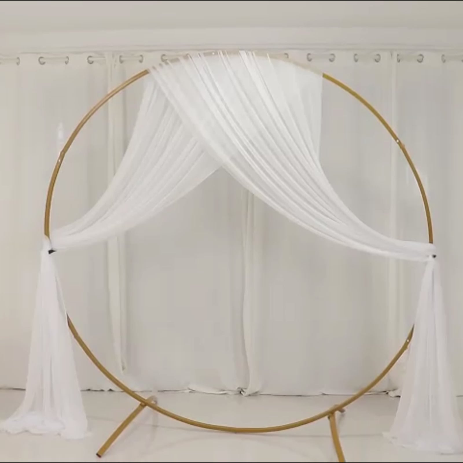 White sheer backdrop drape for wedding arch and ceiling decor.