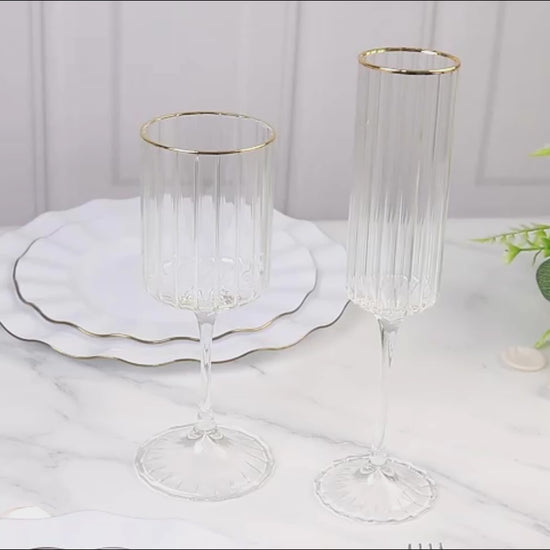 Clear champagne flutes with gold rim, elegant design for celebrations.
