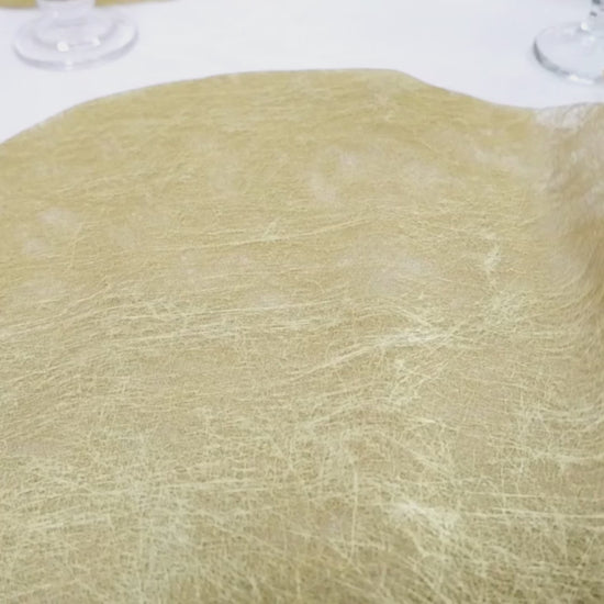 Metallic gold round placemat for dining and events, 13 inches in diameter.