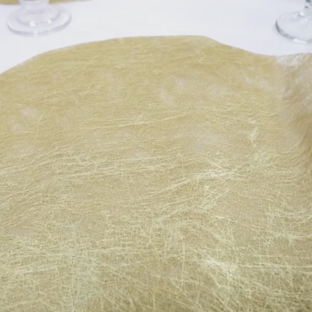 Metallic gold round placemat for dining and events, 13 inches in diameter.