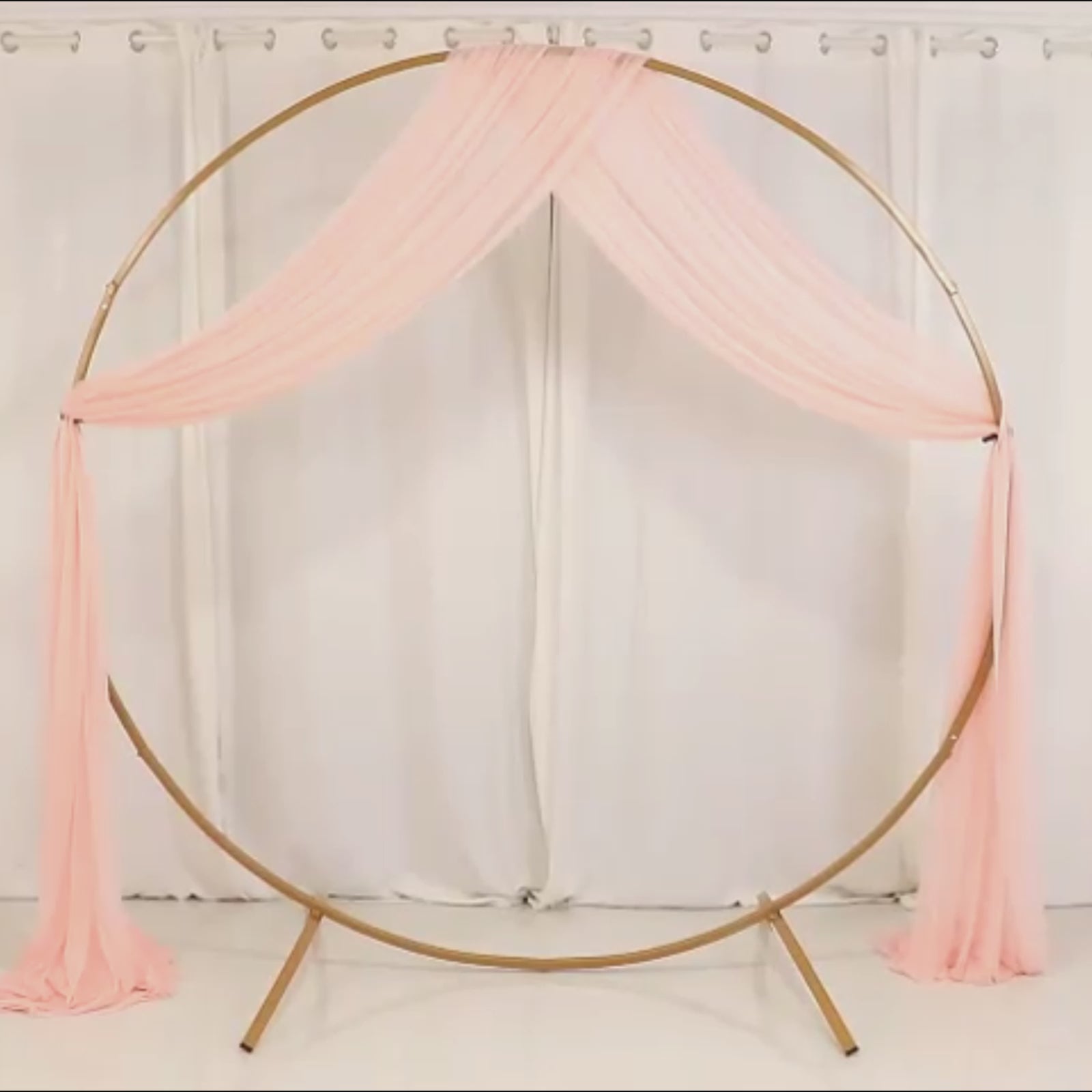 Blush sheer backdrop drape for wedding arch and ceiling decor.