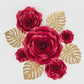 Set of red 3D rose paper flowers with gold palm leaves for wall decor.
