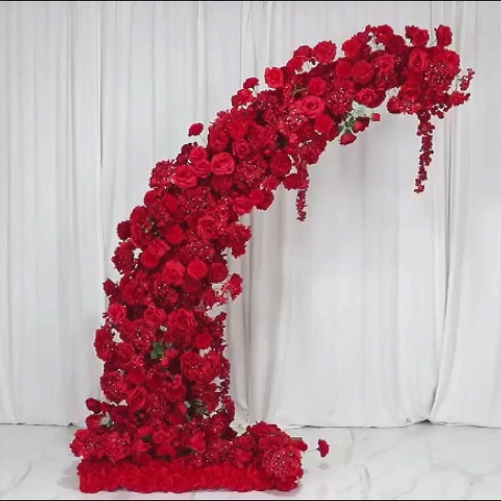 Red floral backdrop for an 8ft half crescent wedding arch.