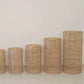 Natural woven rattan wicker pedestal stands in various heights.