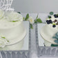 Silver metal crystal pendant cake stands with mirror tops, stackable dessert trays.
