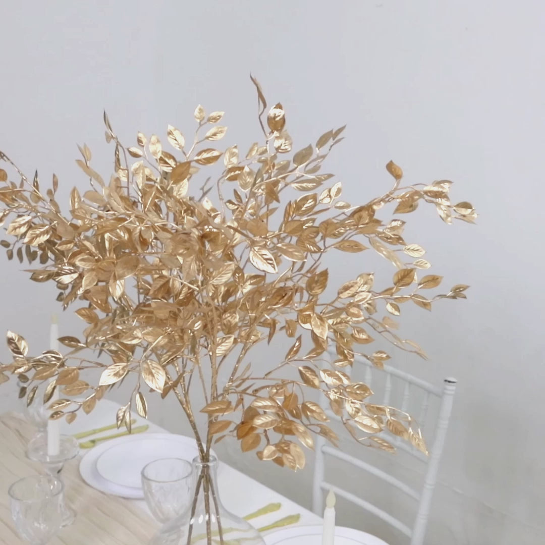 Gold metallic artificial leaf spray for decorative arrangements.