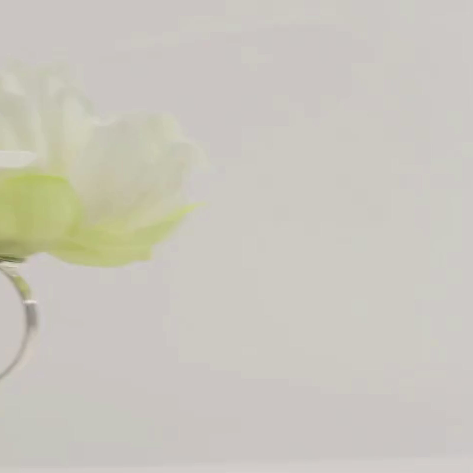 Ivory floral napkin holder with silk peony flower for dining table settings.