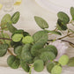 6ft artificial eucalyptus garland with cream silk roses and greenery.