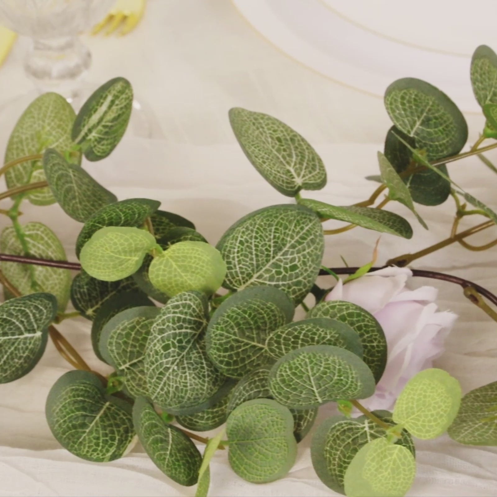6ft artificial eucalyptus garland with cream silk roses and greenery.