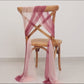 Mauve and blush sheer chair drape decor on a wooden chair.