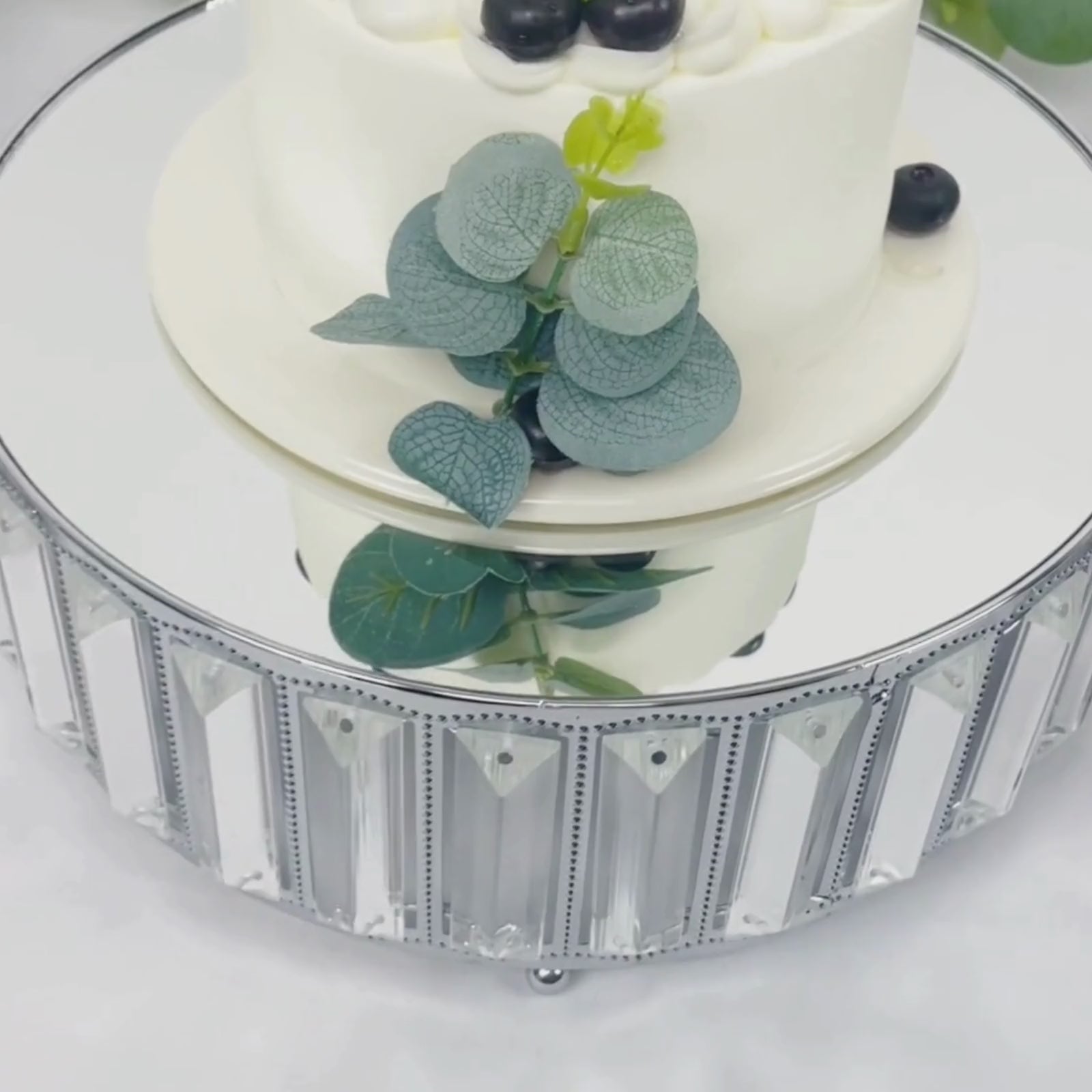 Silver metal crystal pendant cake stand with mirror top and dessert display.