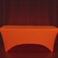 Glow Neon Orange Fitted Spandex Tablecloth on a 6ft rectangle table.