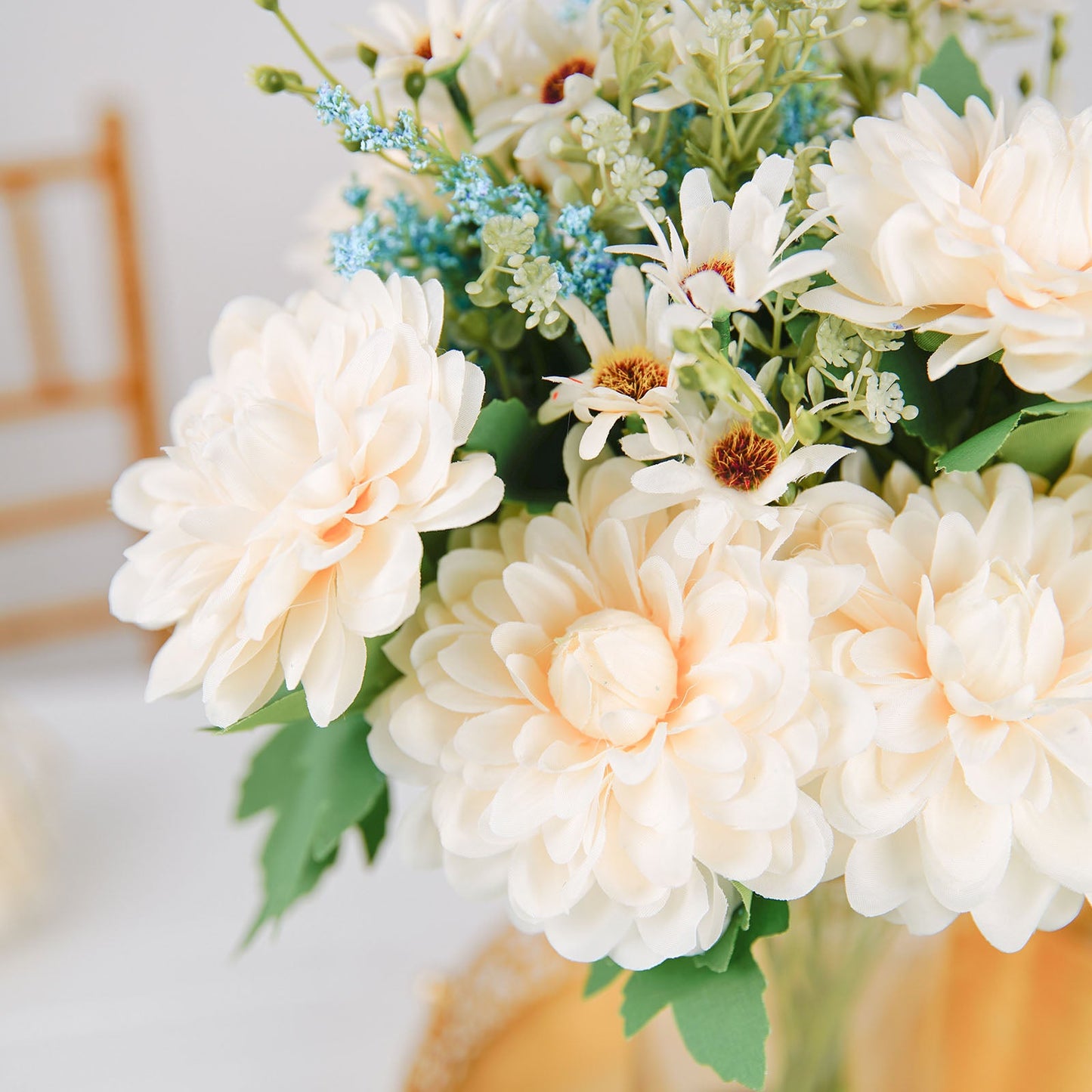 Ivory artificial silk dahlia flower bouquet spray with greenery.