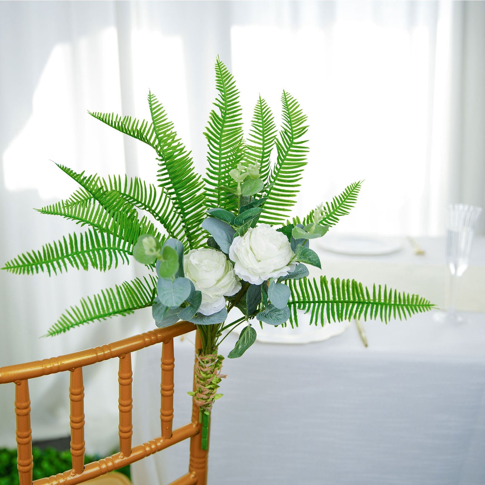 Artificial green cycas fern leaf indoor bush with faux plants.