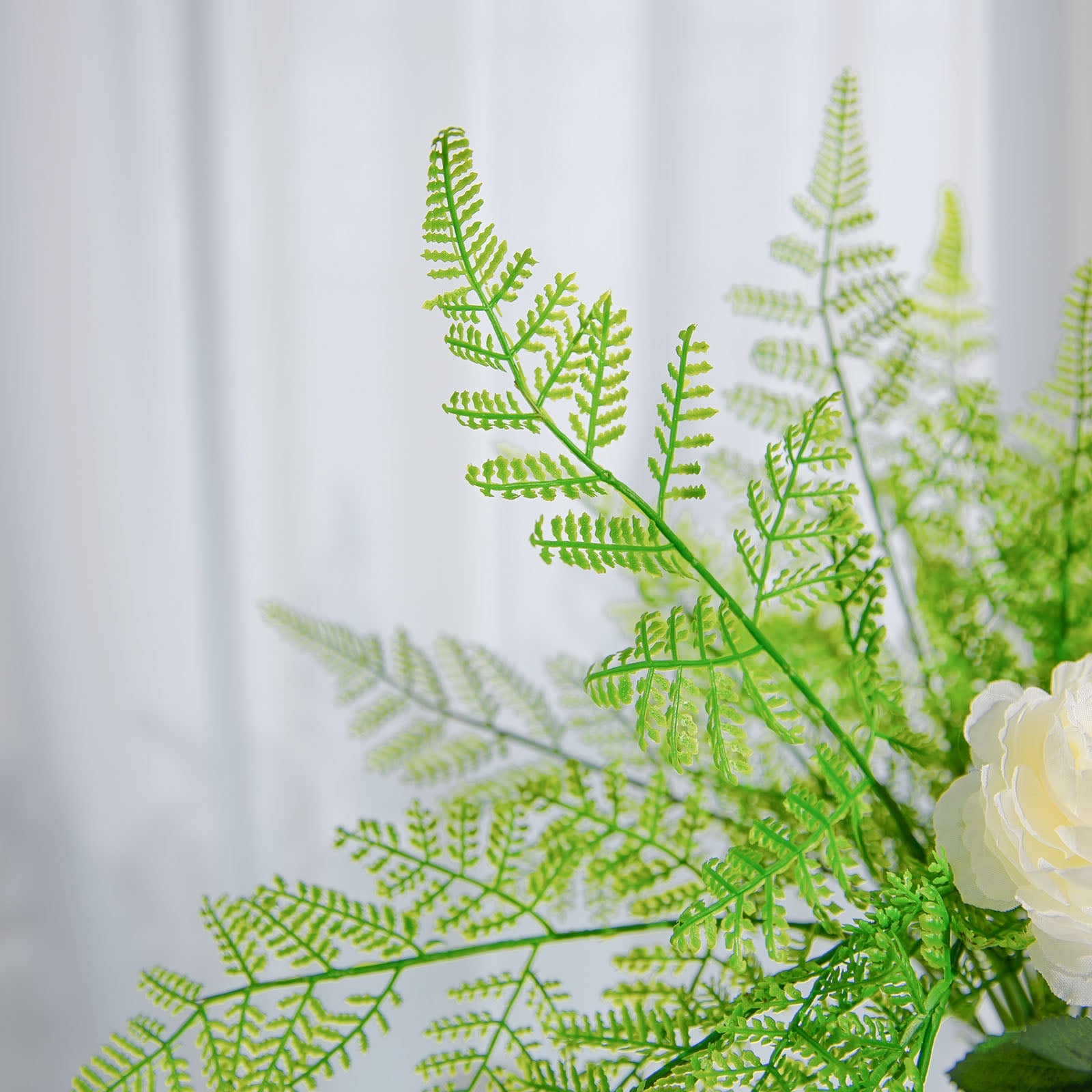 Green artificial asparagus fern leaf plant faux spray.
