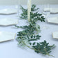 6ft green artificial honey locust leaf garland on a table setting.