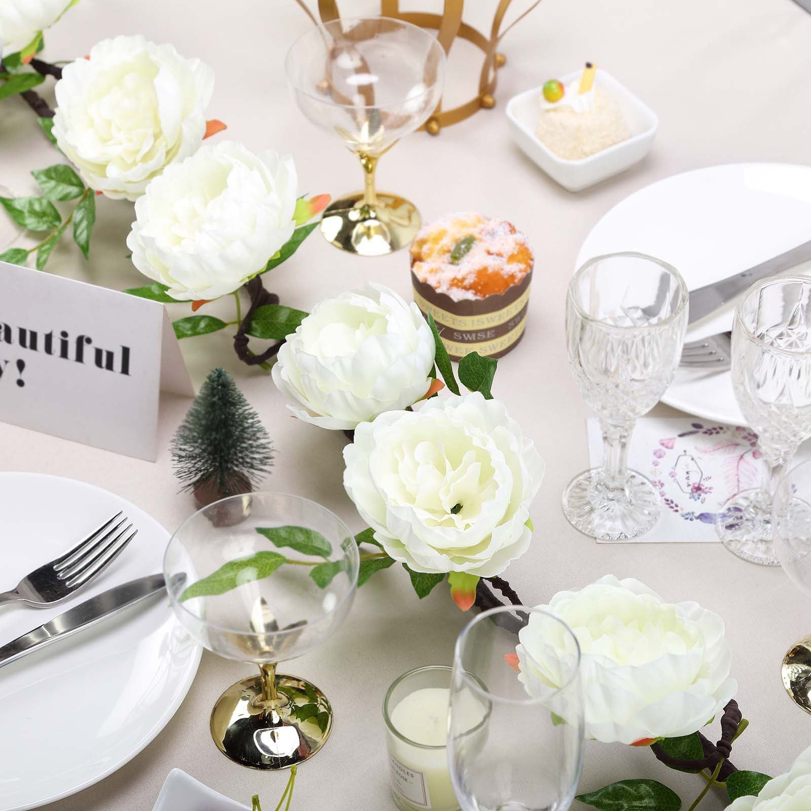 Cream artificial silk peony hanging flower garland on a table setting.