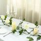 Cream artificial rose and leaf flower garland vine decoration for table.