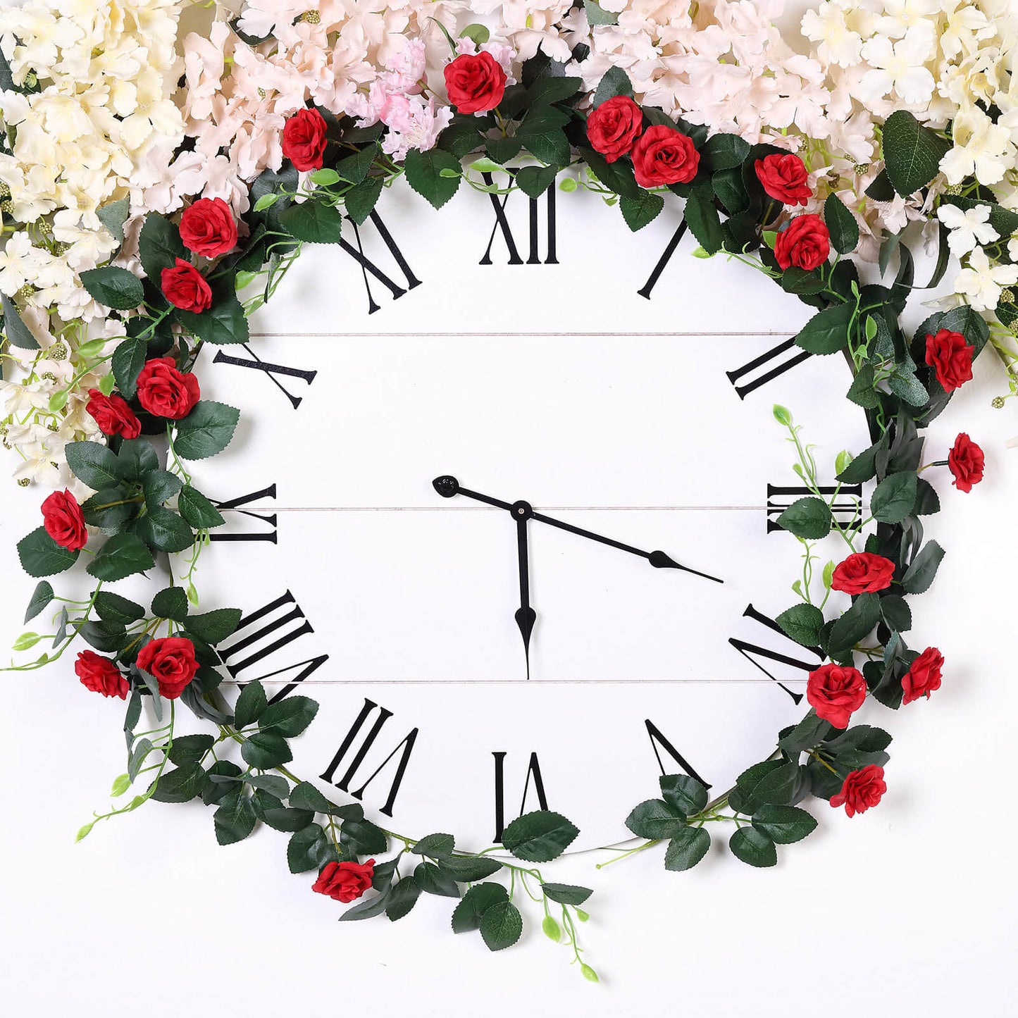Red artificial silk roses flower garland clock decor.