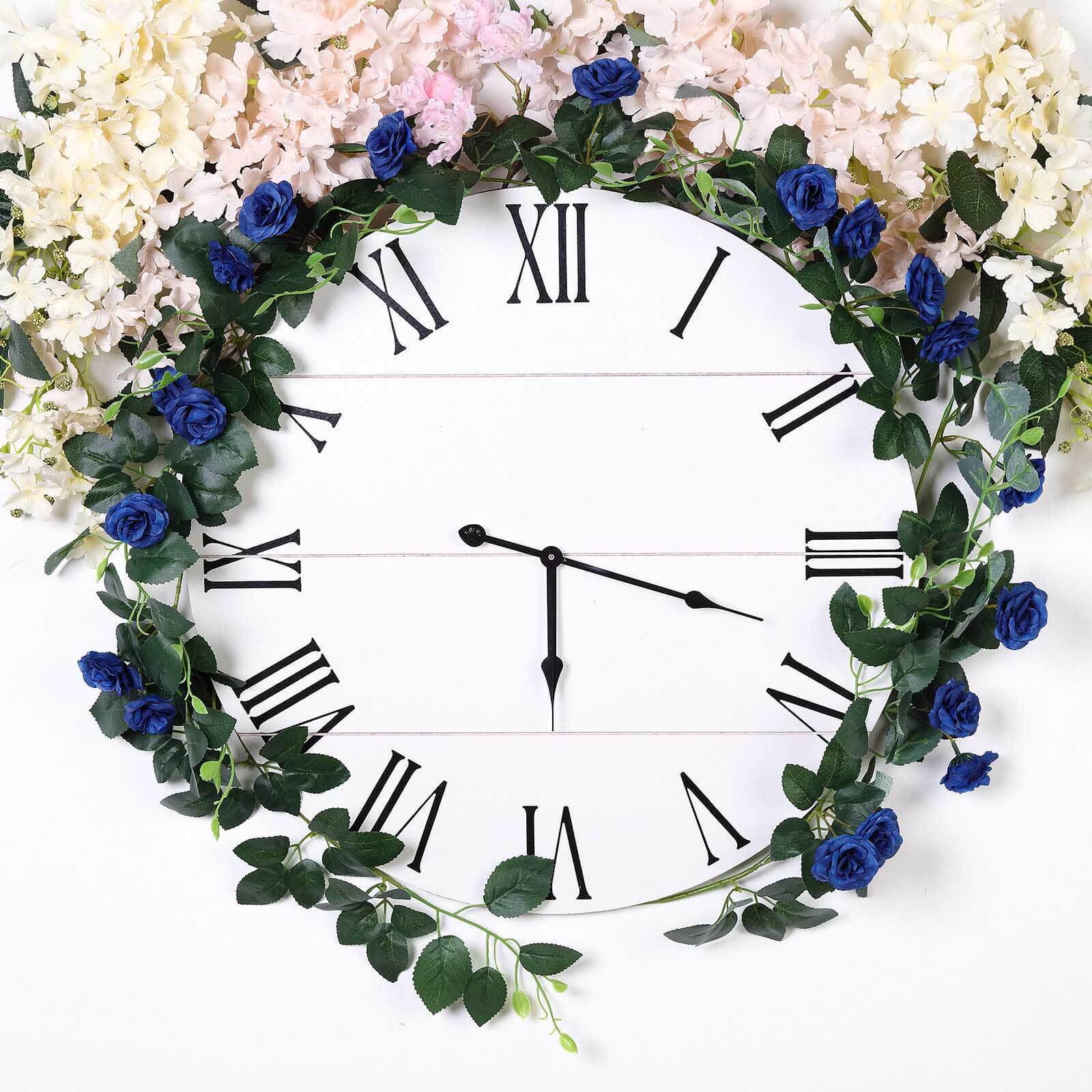 Royal blue artificial silk roses flower garland hanging on a clock.