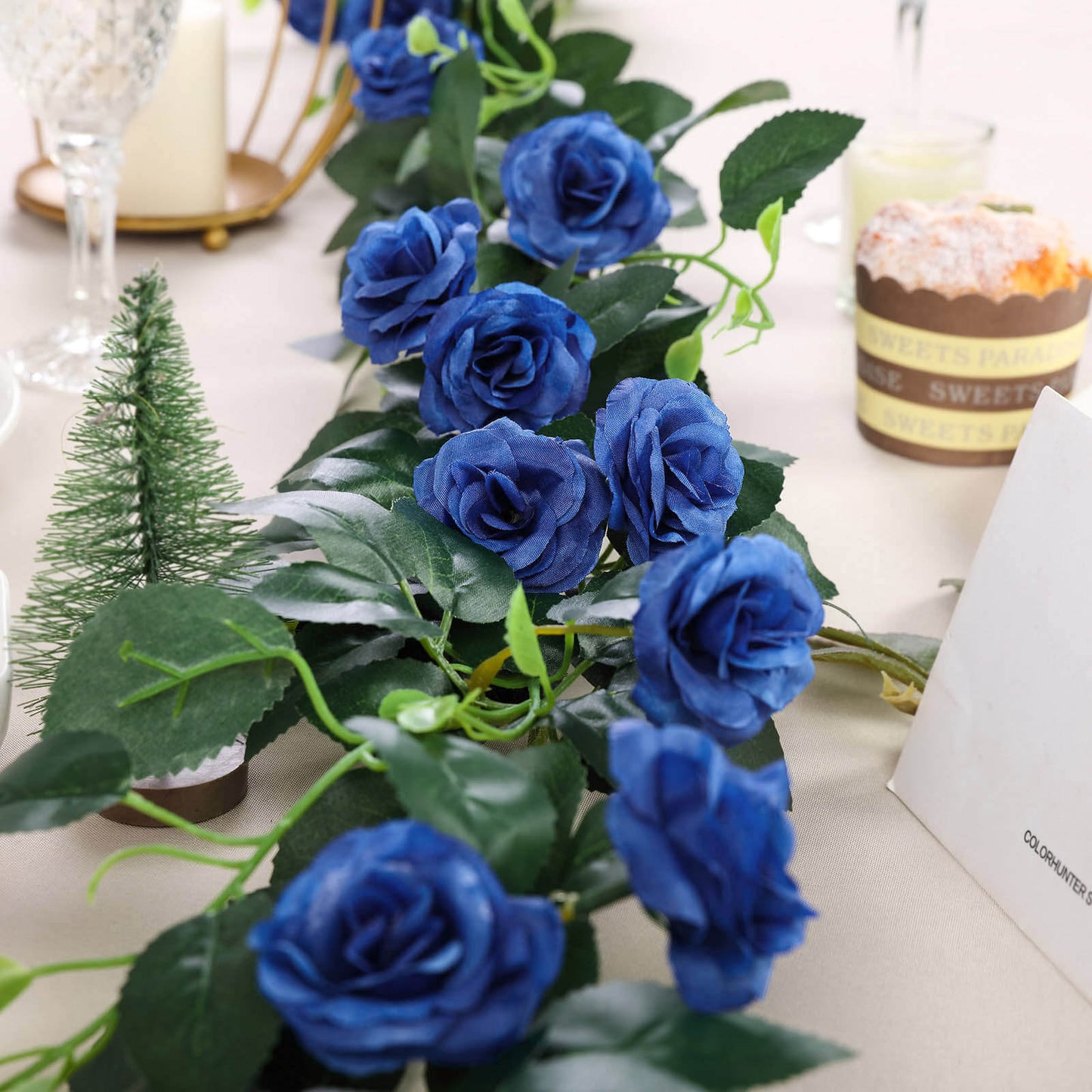 Royal blue artificial silk roses garland, perfect for decoration.
