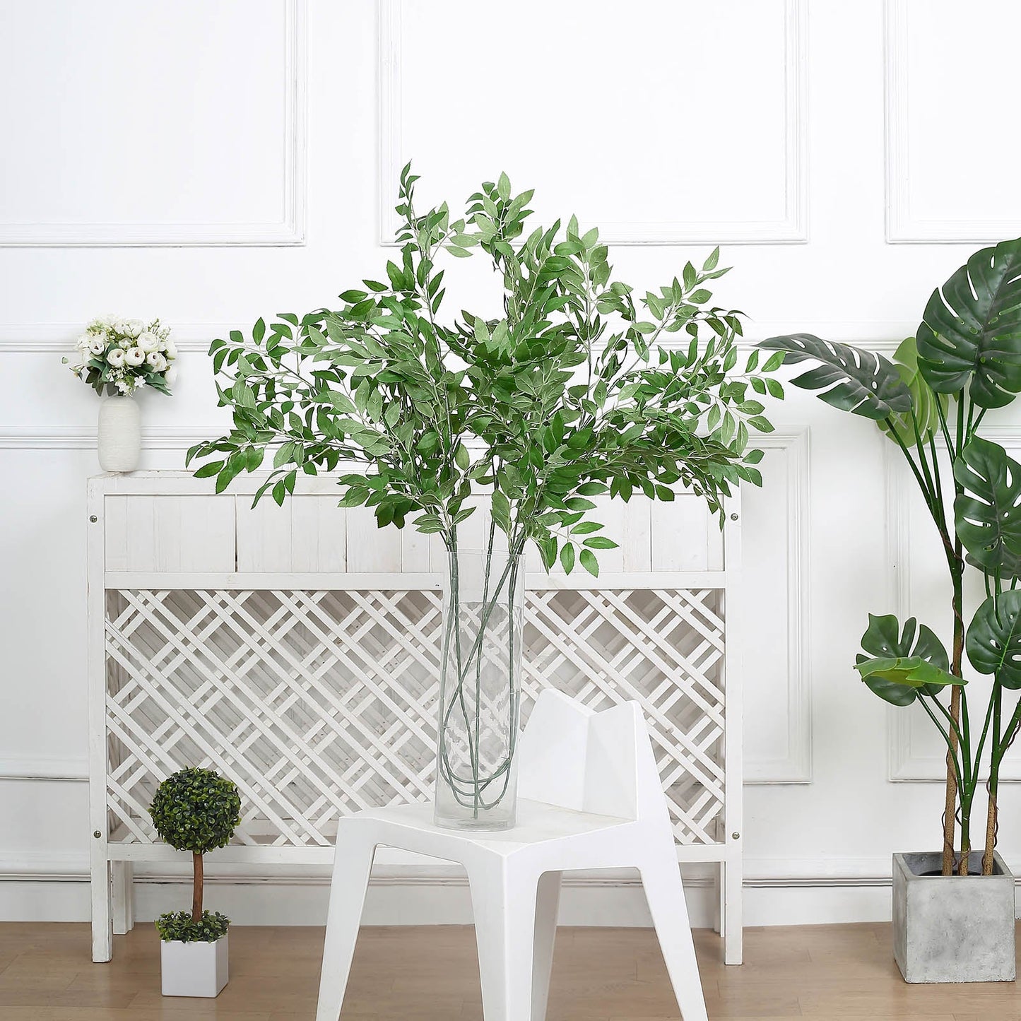 Light green artificial beech leaf branches in a vase.