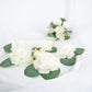 Frosted green eucalyptus leaves on a white surface, ideal for decoration.