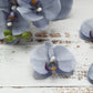 Charcoal gray artificial silk orchid flower heads for DIY crafts.