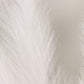 White artificial pampas grass plant sprays in a vase arrangement.