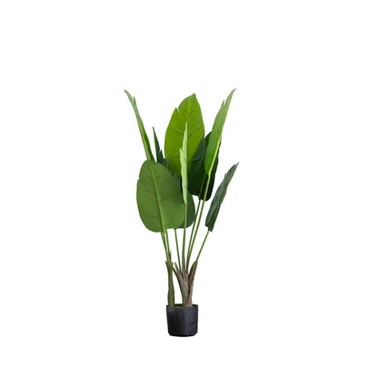 Green faux potted Bird of Paradise plant in a black pot.