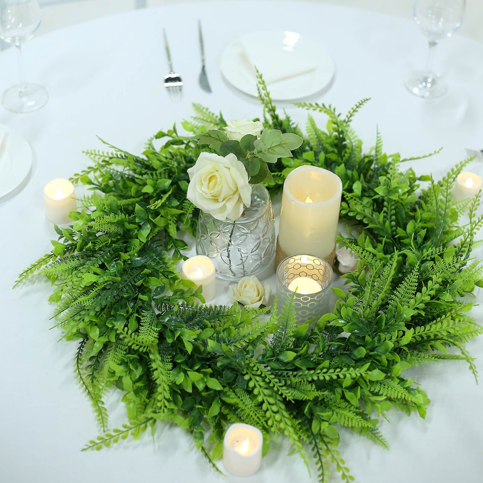 22" Green Artificial Boxwood Fern Mix Spring Wreaths on a white table setting.