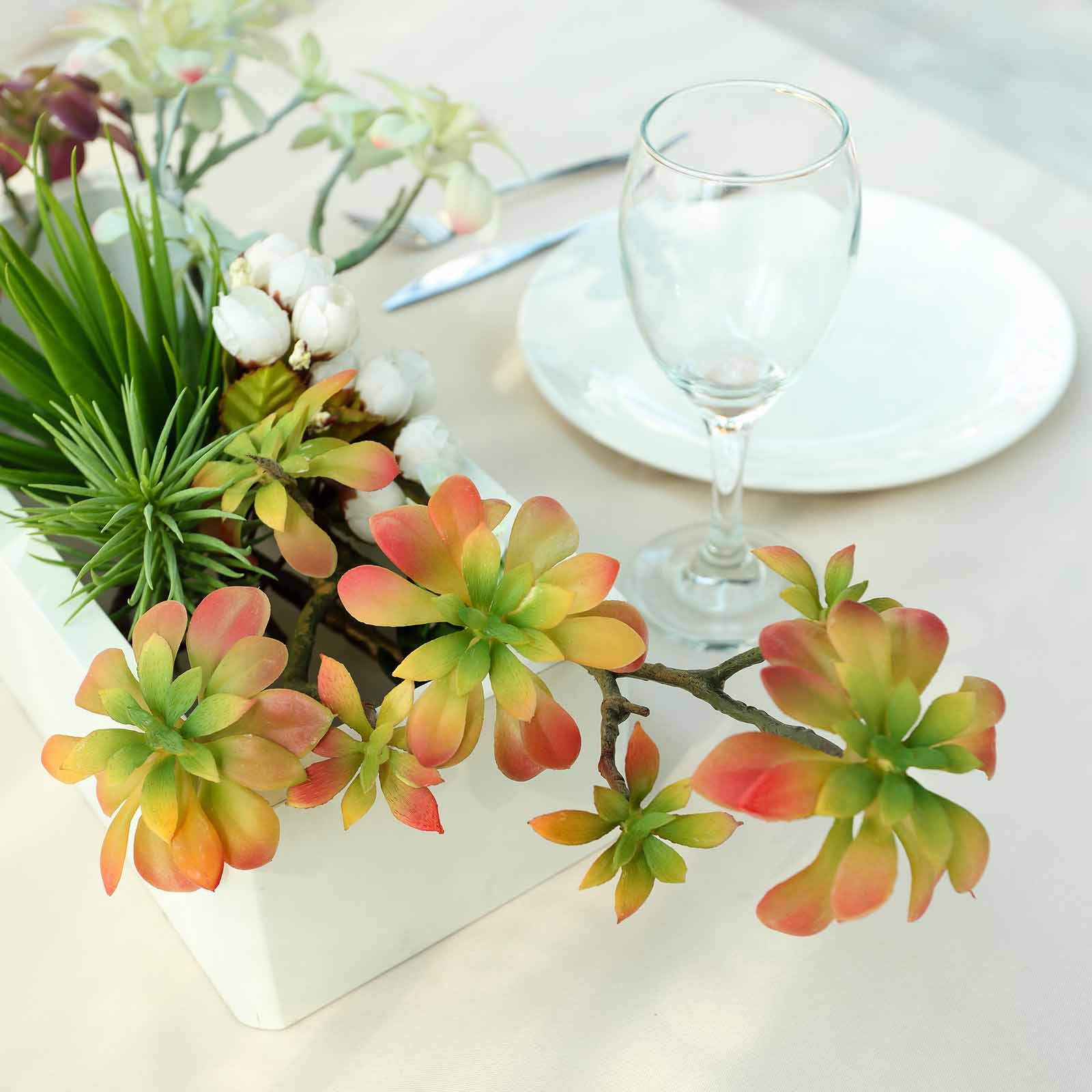 Assorted artificial aeonium spray succulents in green and pink hues.