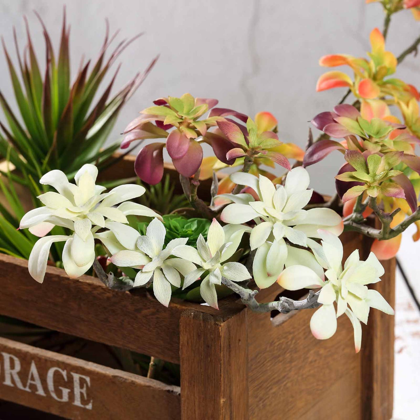 Assorted artificial aeonium spray succulents in shades of green and pink.