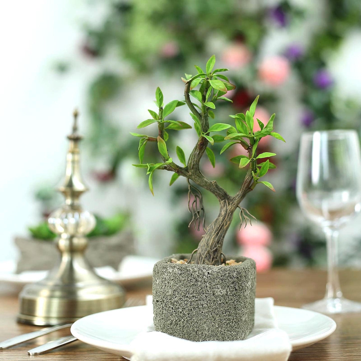 Gray concrete planter with artificial willow tree succulent.